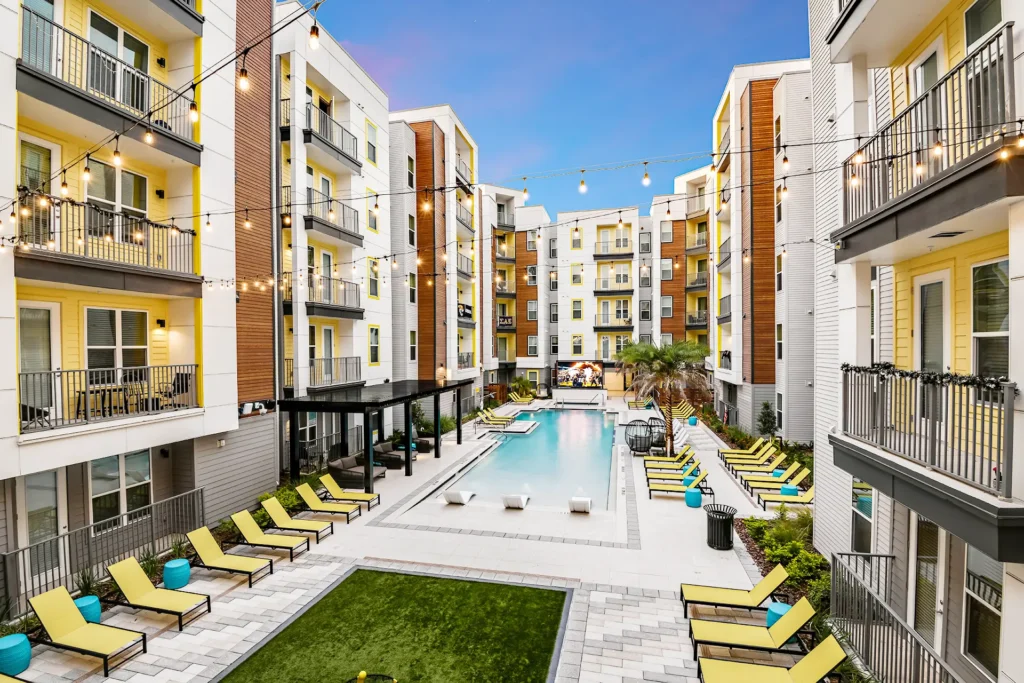 Courtyard of a 5-story wrap student housing with zero entry resort style pool