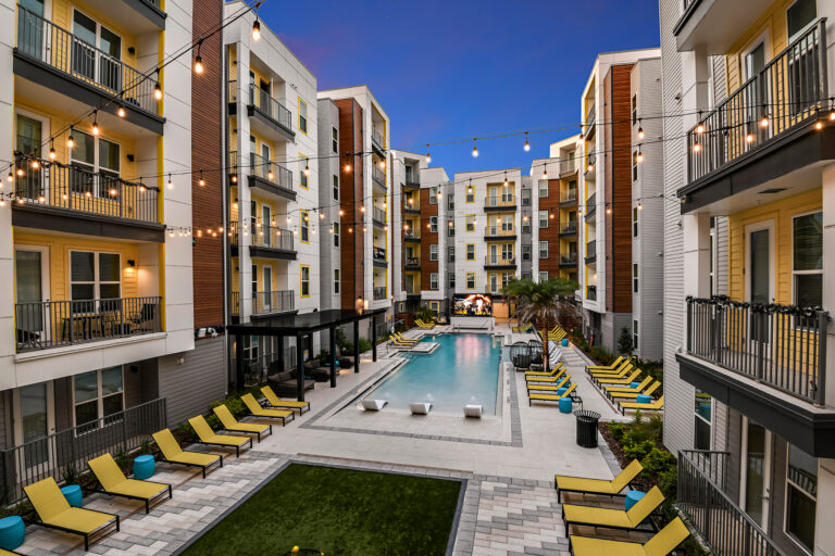 Courtyard of a 5-story wrap student housing with zero entry resort style pool